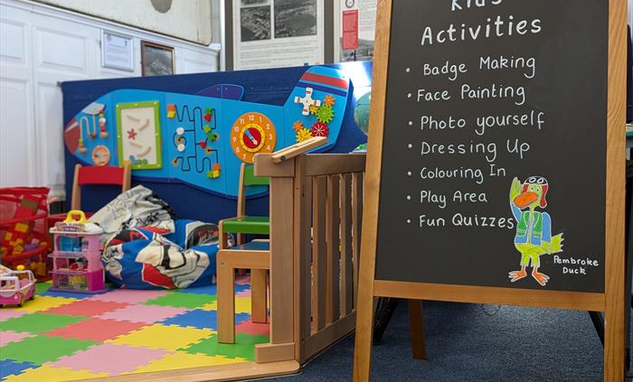 Children's play area with list of activities for kids of all ages